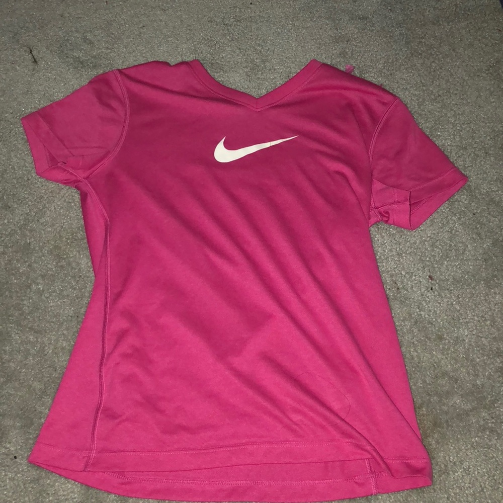 Hot pink nike shirt.